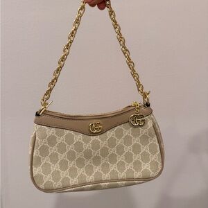Elegant Beige Designer Shoulder Bag with Gold Accents